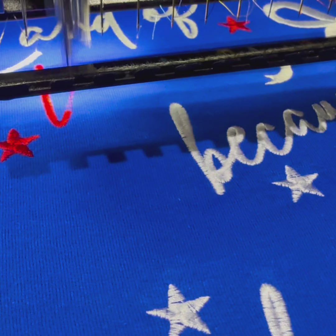 embroidered Land of the free because of the brave